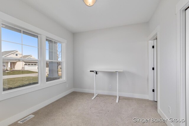 5560 Albright Ave SW Unit 67, Wyoming, MI 49418 - empty room with light colored carpet, visible vents, and baseboards