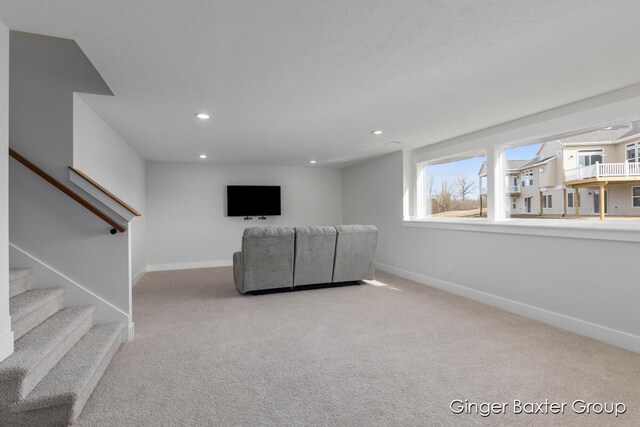 5560 Albright Ave SW Unit 67, Wyoming, MI 49418 - unfurnished living room featuring baseboards, carpet, stairs, and recessed lighting