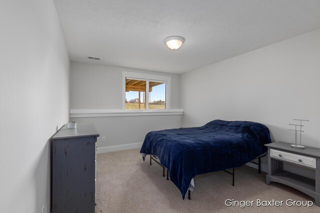 5560 Albright Ave SW Unit 67, Wyoming, MI 49418 - carpeted bedroom with baseboards and visible vents