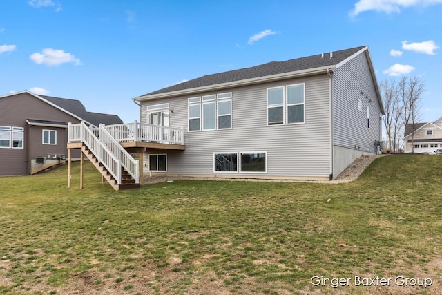 5560 Albright Ave SW Unit 67, Wyoming, MI 49418 - back of property with a wooden deck, a yard, and stairs