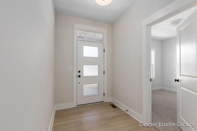 5560 Albright Ave SW Unit 67, Wyoming, MI 49418 - entryway featuring baseboards, light wood-style floors, and visible vents