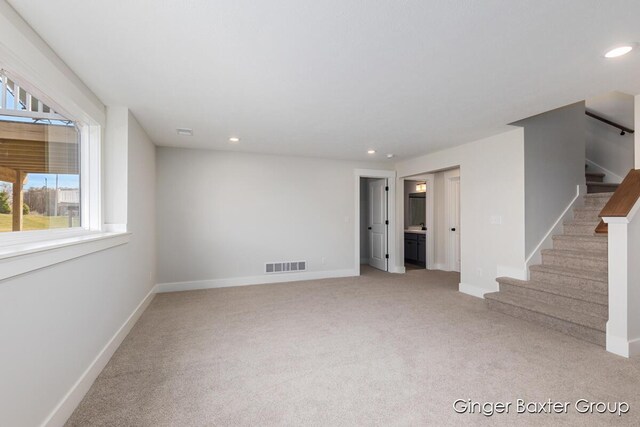 5560 Albright Ave SW Unit 67, Wyoming, MI 49418 - interior space featuring light colored carpet, recessed lighting, stairs, baseboards, and visible vents