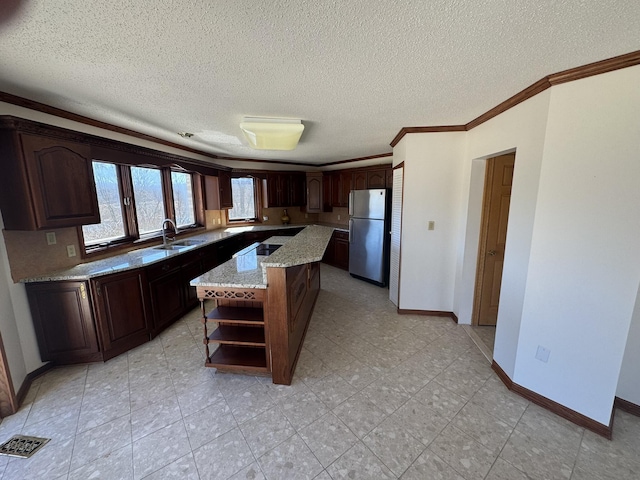 kitchen with visible vents, crown molding, open shelves, a sink, and freestanding refrigerator