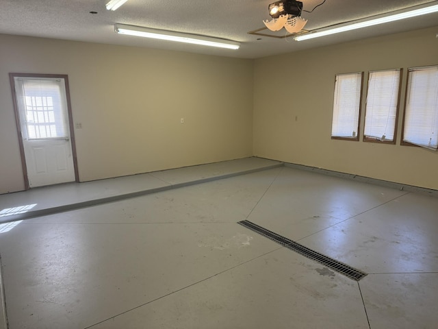 spare room with concrete floors