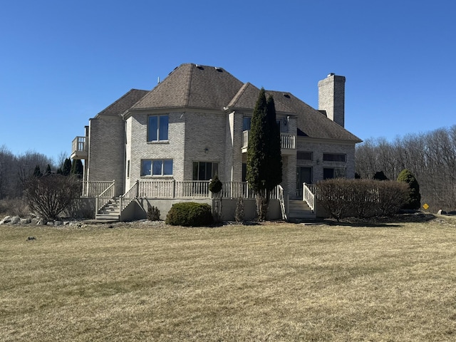 view of property exterior featuring a lawn, a chimney, and brick siding