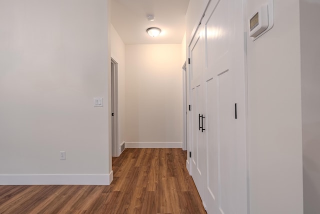 3935 W Destiny Dr, Hart, MI 49420 - hallway with baseboards and dark wood-style flooring