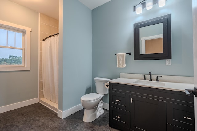 3935 W Destiny Dr, Hart, MI 49420 - bathroom featuring tiled shower, baseboards, toilet, and vanity