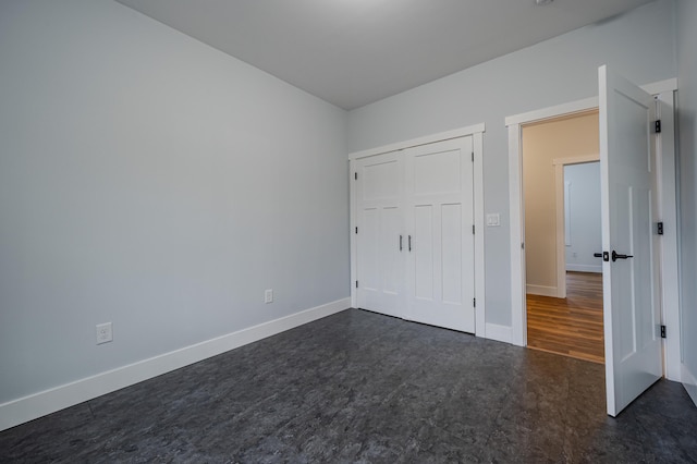 3935 W Destiny Dr, Hart, MI 49420 - unfurnished bedroom with baseboards and a closet