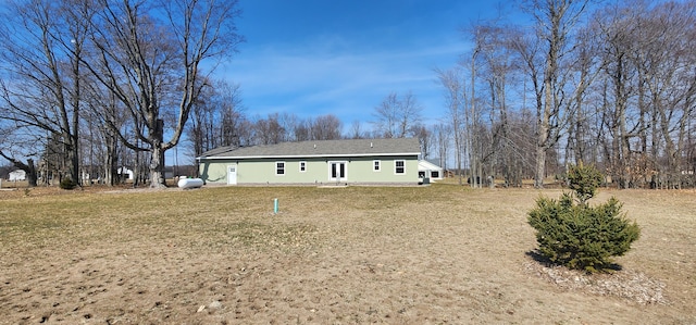 3935 W Destiny Dr, Hart, MI 49420 - rear view of property featuring a lawn and a shingled roof