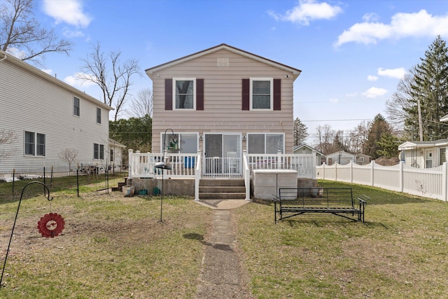 1169 Shady Shores Dr, Niles, MI 49120 - view of front facade with a wooden deck, fence private yard, and a front lawn