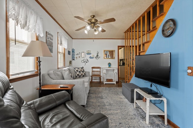 1169 Shady Shores Dr, Niles, MI 49120 - living area with stairway, wood finished floors, a ceiling fan, and crown molding