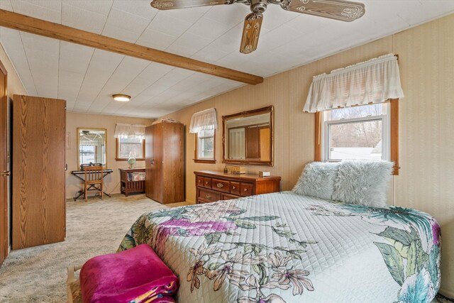 1169 Shady Shores Dr, Niles, MI 49120 - bedroom featuring wallpapered walls, beamed ceiling, ceiling fan, and light carpet