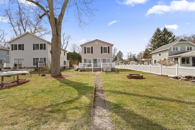1169 Shady Shores Dr, Niles, MI 49120 - view of yard featuring a sunroom, a fire pit, and fence
