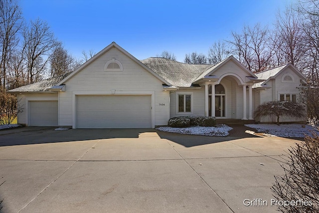 7834 Strawberry Ln NE, Belmont, MI 49306 - view of front of house with an attached garage and concrete driveway