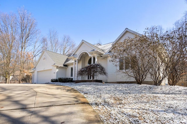 7834 Strawberry Ln NE, Belmont, MI 49306 - view of front facade with a garage and driveway