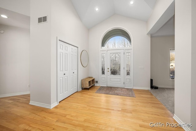 7834 Strawberry Ln NE, Belmont, MI 49306 - entryway featuring light wood-style flooring, recessed lighting, visible vents, and high vaulted ceiling