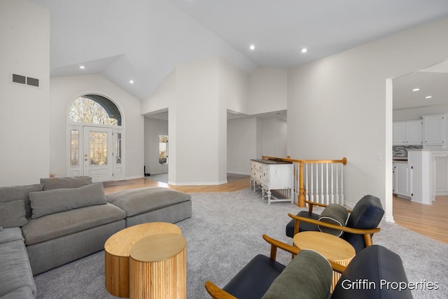 7834 Strawberry Ln NE, Belmont, MI 49306 - living room featuring light wood-type flooring, visible vents, high vaulted ceiling, recessed lighting, and baseboards