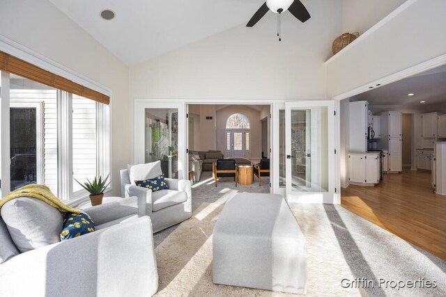 7834 Strawberry Ln NE, Belmont, MI 49306 - living room featuring french doors, high vaulted ceiling, a ceiling fan, and light wood finished floors