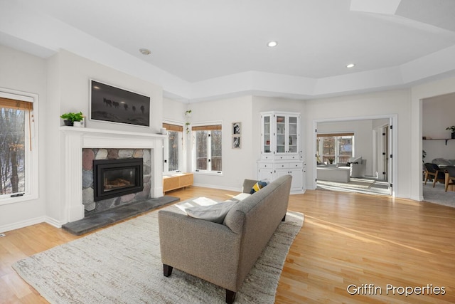 7834 Strawberry Ln NE, Belmont, MI 49306 - living area with recessed lighting, baseboards, light wood-style floors, and a fireplace