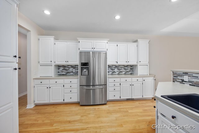 7834 Strawberry Ln NE, Belmont, MI 49306 - kitchen featuring recessed lighting, stainless steel fridge, white cabinets, light wood finished floors, and light countertops