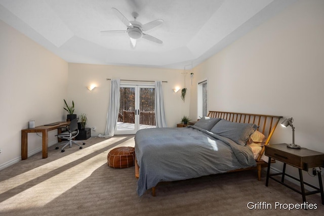7834 Strawberry Ln NE, Belmont, MI 49306 - bedroom featuring baseboards, a tray ceiling, carpet flooring, a ceiling fan, and access to outside