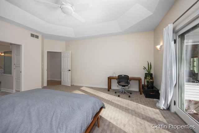 7834 Strawberry Ln NE, Belmont, MI 49306 - bedroom with visible vents, baseboards, a raised ceiling, light colored carpet, and ceiling fan