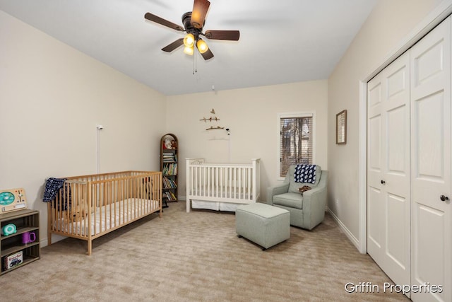 7834 Strawberry Ln NE, Belmont, MI 49306 - carpeted bedroom with a closet, baseboards, a nursery area, and a ceiling fan