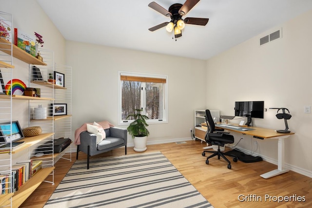 7834 Strawberry Ln NE, Belmont, MI 49306 - home office featuring visible vents, baseboards, ceiling fan, and wood finished floors