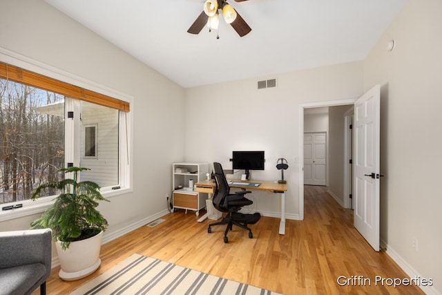 7834 Strawberry Ln NE, Belmont, MI 49306 - home office featuring visible vents, baseboards, a ceiling fan, and wood finished floors