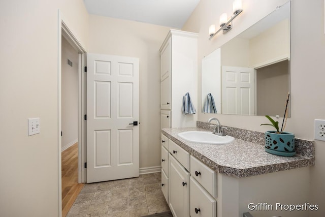 7834 Strawberry Ln NE, Belmont, MI 49306 - bathroom with baseboards and vanity