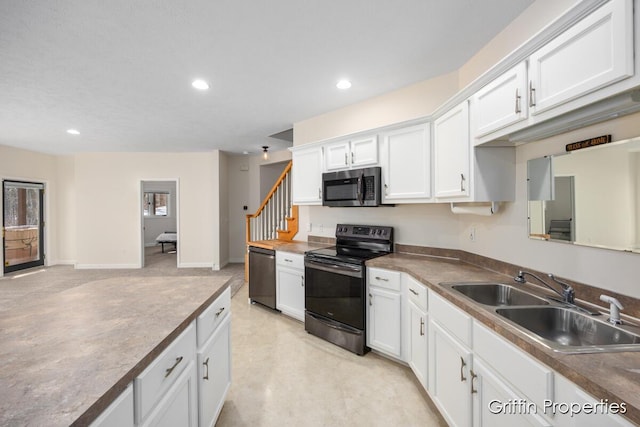 7834 Strawberry Ln NE, Belmont, MI 49306 - kitchen featuring baseboards, recessed lighting, appliances with stainless steel finishes, white cabinetry, and a sink