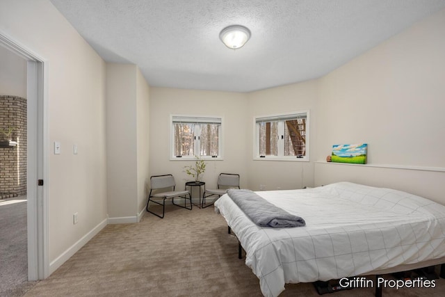 7834 Strawberry Ln NE, Belmont, MI 49306 - carpeted bedroom featuring baseboards and a textured ceiling