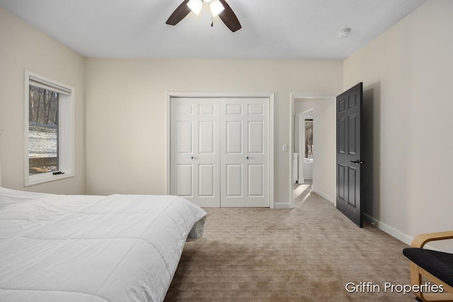 7834 Strawberry Ln NE, Belmont, MI 49306 - bedroom with a closet, a ceiling fan, baseboards, and carpet floors