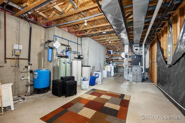 7834 Strawberry Ln NE, Belmont, MI 49306 - unfinished basement featuring heating unit and washer / dryer