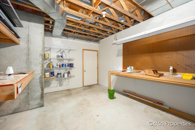 7834 Strawberry Ln NE, Belmont, MI 49306 - unfinished below grade area with a workshop area