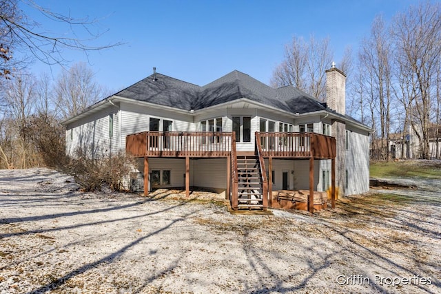 7834 Strawberry Ln NE, Belmont, MI 49306 - back of property with stairs, a wooden deck, and a chimney