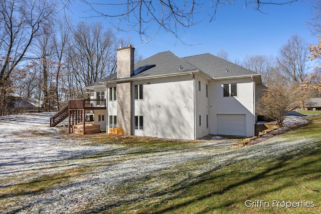 7834 Strawberry Ln NE, Belmont, MI 49306 - view of side of home with driveway, an attached garage, a chimney, stairs, and a deck