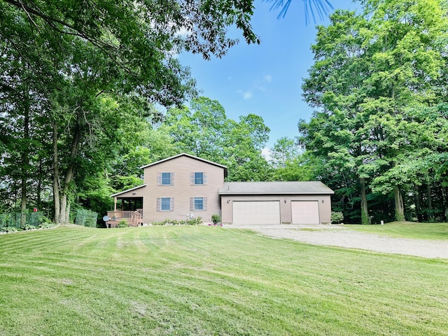 8440 S Felch Ave, Newaygo, MI 49337 - view of property exterior with driveway, a yard, a garage, and view of scattered trees
