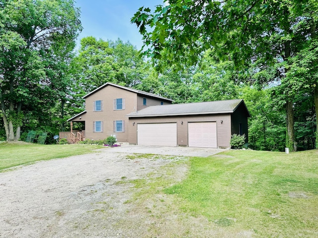 8440 S Felch Ave, Newaygo, MI 49337 - view of front of property with driveway, a front yard, and an attached garage