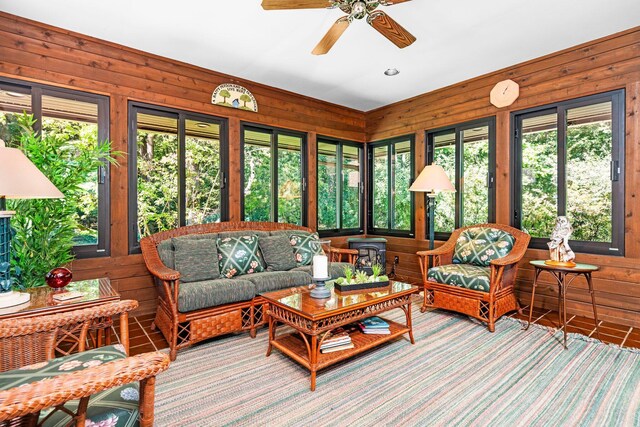 4923 Hickory Hill Rd, Ann Arbor, MI 48105 - sunroom featuring an outdoor hangout area, wood walls, and ceiling fan