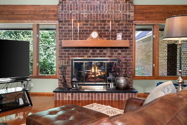 4923 Hickory Hill Rd, Ann Arbor, MI 48105 - living area with wood-type flooring and a fireplace
