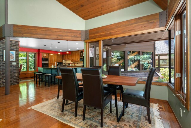 4923 Hickory Hill Rd, Ann Arbor, MI 48105 - dining room with high vaulted ceiling and hardwood / wood-style flooring