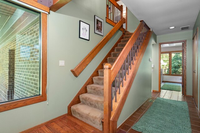 4923 Hickory Hill Rd, Ann Arbor, MI 48105 - stairs featuring baseboards, visible vents, wood finished floors, and recessed lighting