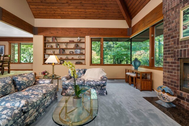 4923 Hickory Hill Rd, Ann Arbor, MI 48105 - living area with vaulted ceiling, wooden ceiling, carpet flooring, and a fireplace
