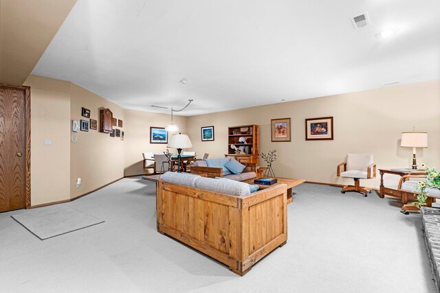 4923 Hickory Hill Rd, Ann Arbor, MI 48105 - living room featuring baseboards, light colored carpet, and visible vents