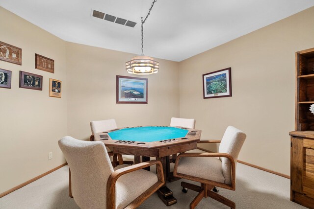 4923 Hickory Hill Rd, Ann Arbor, MI 48105 - dining area with baseboards, carpet floors, visible vents, and a chandelier