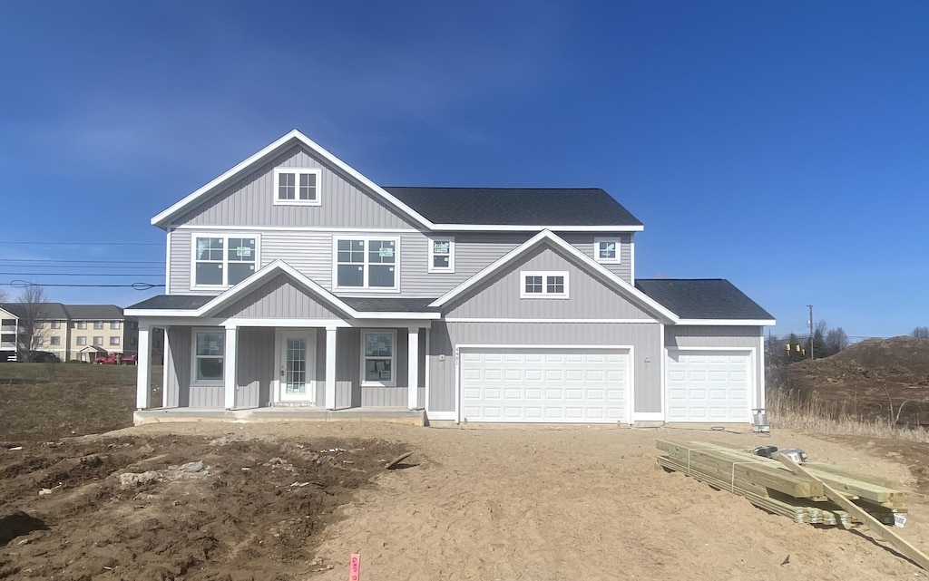 view of front of property with a porch and driveway