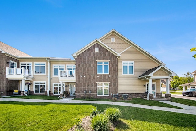 616 Boardwalk Ln, Dexter, MI 48130 - view of front of house with a front yard and brick siding