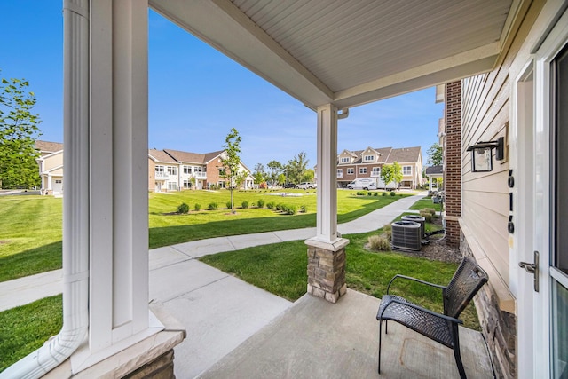616 Boardwalk Ln, Dexter, MI 48130 - covered porch featuring a residential view, a yard, and central AC