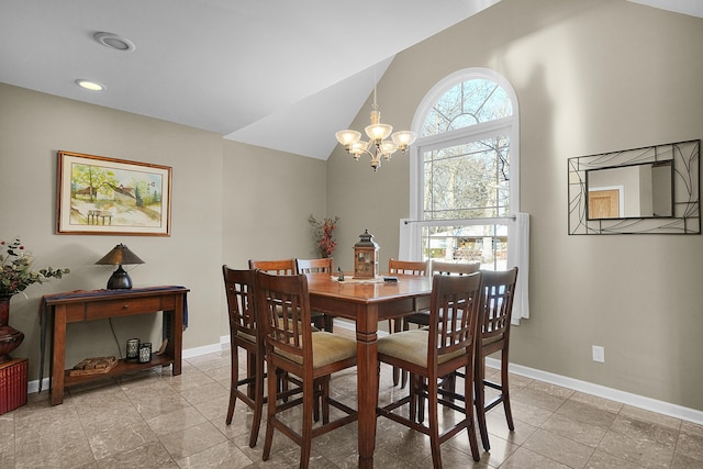 dining room with a chandelier, recessed lighting, baseboards, and vaulted ceiling